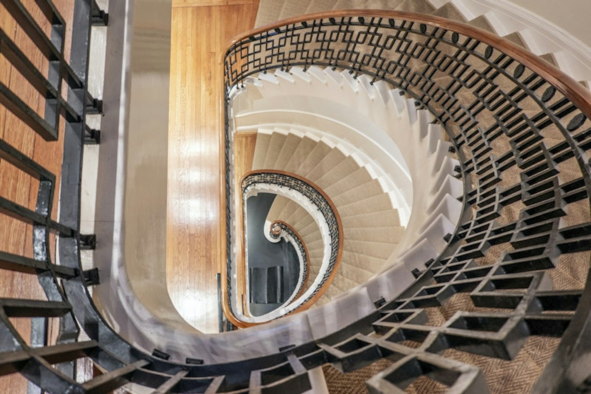 36 East 63rd Street Manhattan, NY 10065 - Photo 18 of 21 a view of a livingroom with furniture and staircase