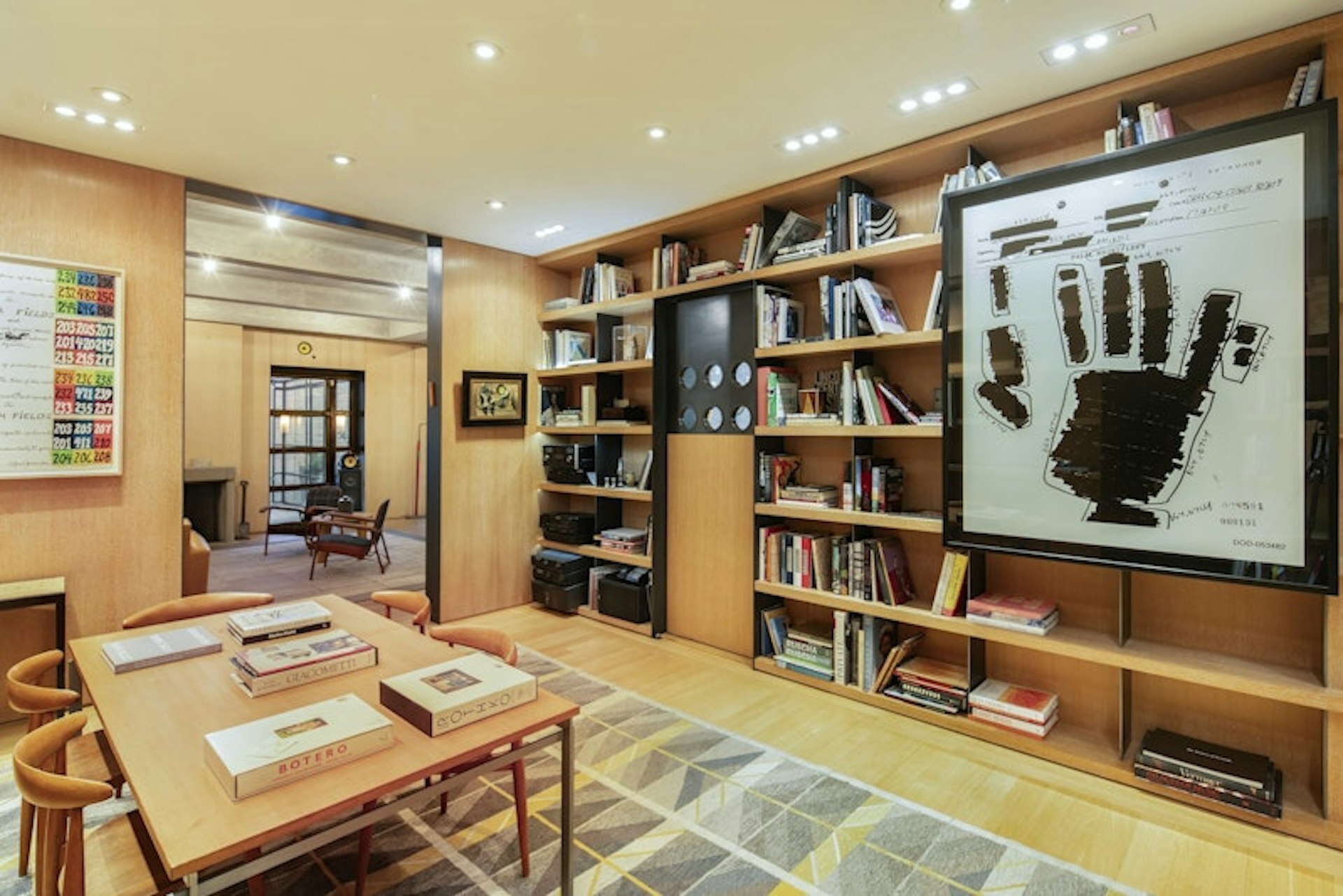 36 East 63rd Street Manhattan, NY 10065 - Photo 5 of 21 a living room with lots of furniture and a book shelf