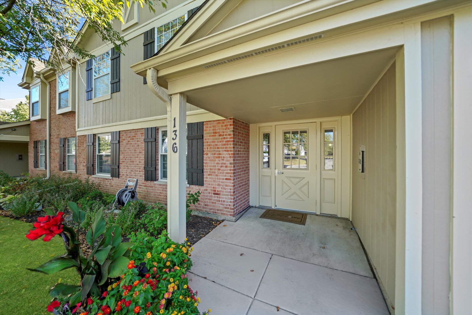 136 Wolcott Court, Unit O2 Schaumburg, IL 60193 - Photo 2 of 31 a view of a house with a porch