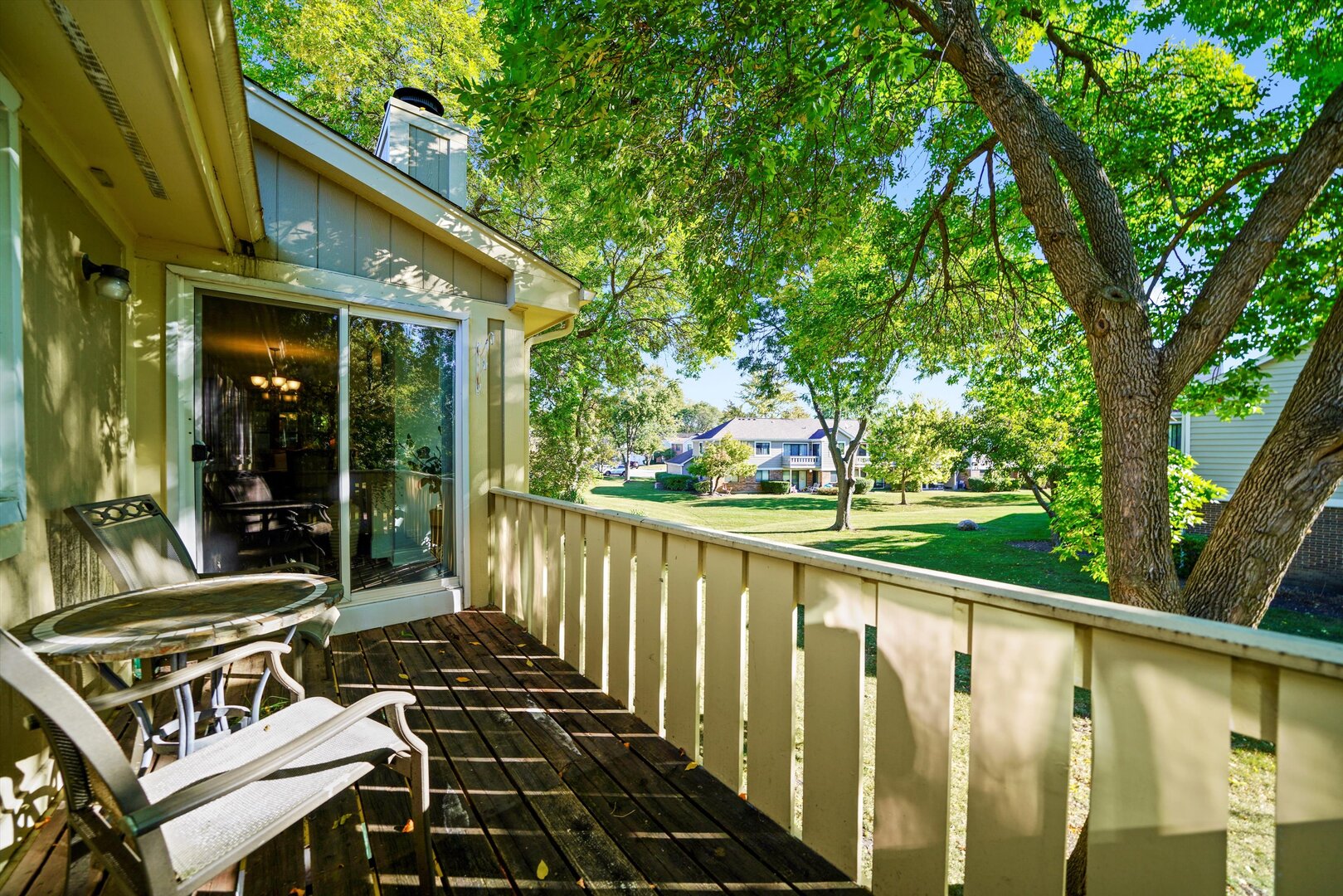 136 Wolcott Court, Unit O2 Schaumburg, IL 60193 - Photo 21 of 31 a view of balcony with wooden floor and outdoor seating