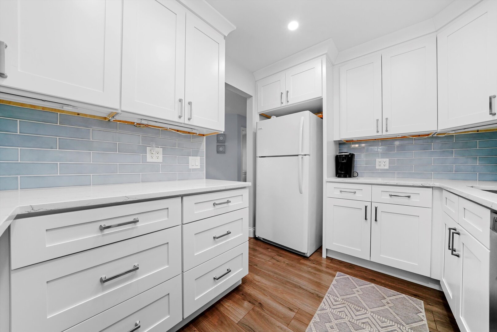 136 Wolcott Court, Unit O2 Schaumburg, IL 60193 - Photo 5 of 31 a kitchen with cabinets stainless steel appliances and cabinets