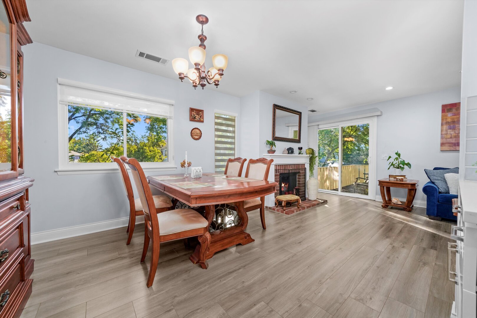 136 Wolcott Court, Unit O2 Schaumburg, IL 60193 - Photo 6 of 31 a view of a dining room with furniture window and wooden floor
