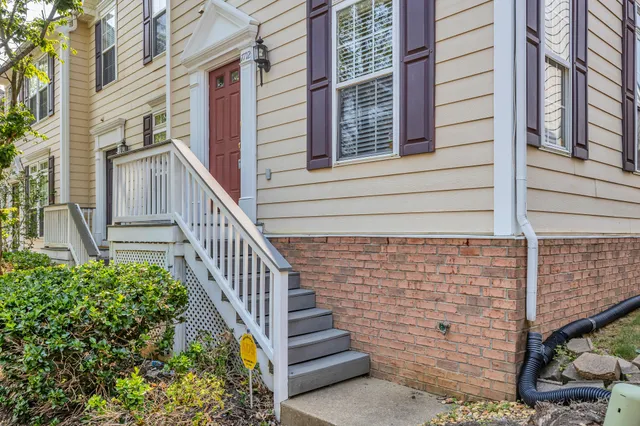 a view of a house with stairs and wooden floor