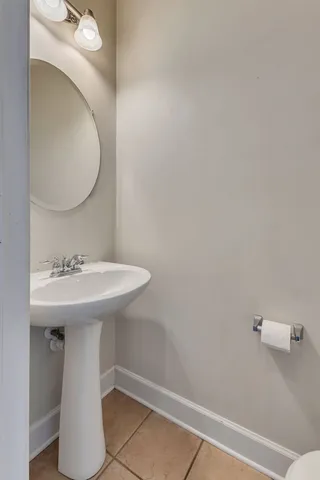a bathroom with a sink a mirror and vanity
