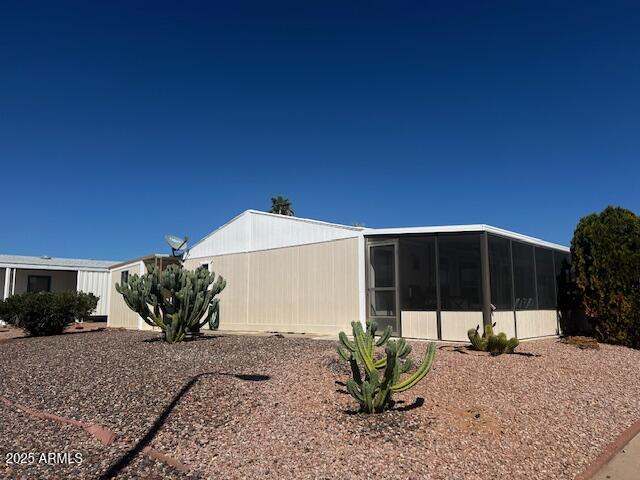 834 South Meridian Road, Unit 118 Apache Junction, AZ 85120 - Photo 7 of 50 a view of a house with backyard and sitting area