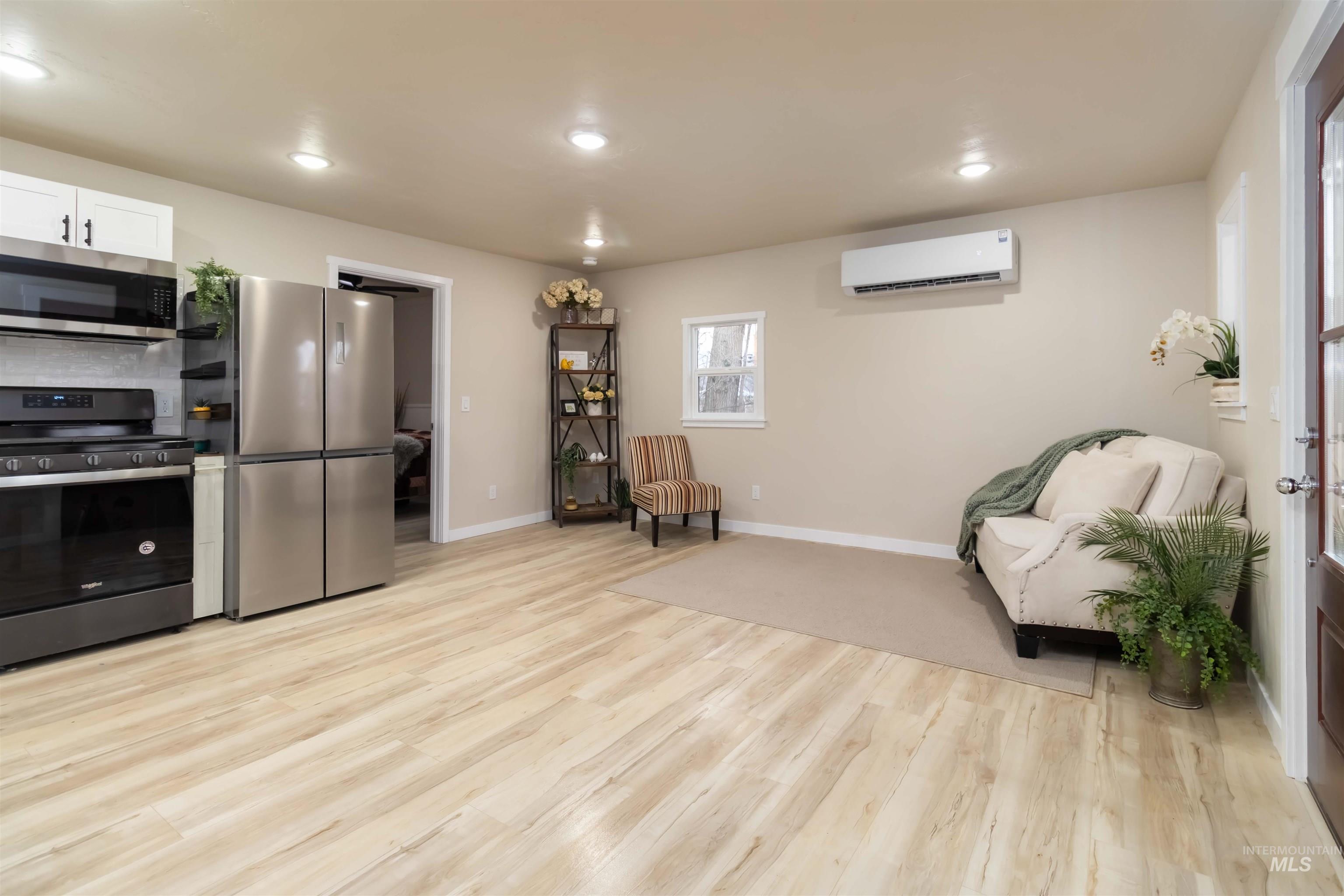 1012 East Main Street Weiser, ID 83672 - Photo 8 of 15 Living area with light wood finished floors and recessed lighting