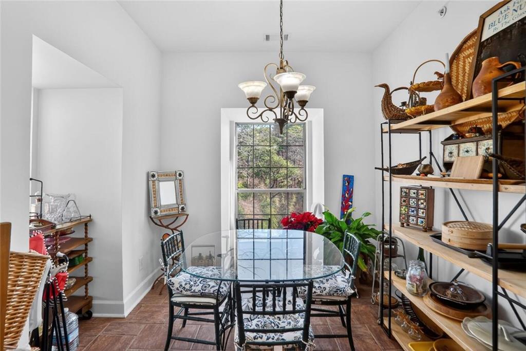 2921 Lenox Road Northeast, Unit 413 Atlanta, GA 30324 - Photo 11 of 36 a dining room with furniture and window