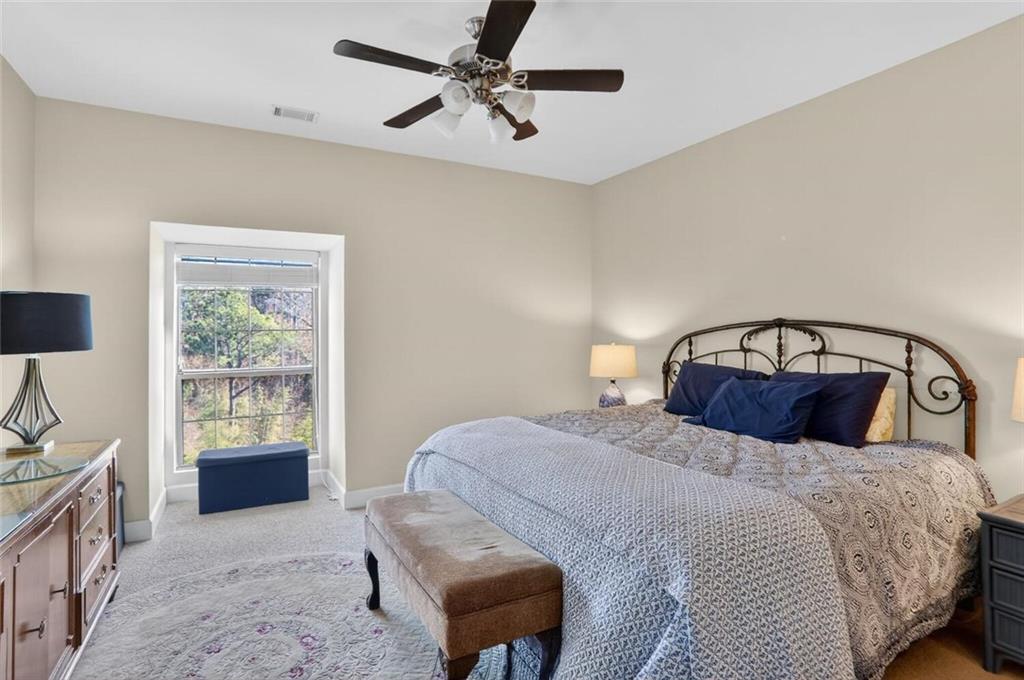2921 Lenox Road Northeast, Unit 413 Atlanta, GA 30324 - Photo 14 of 36 a bedroom with a bed and a window