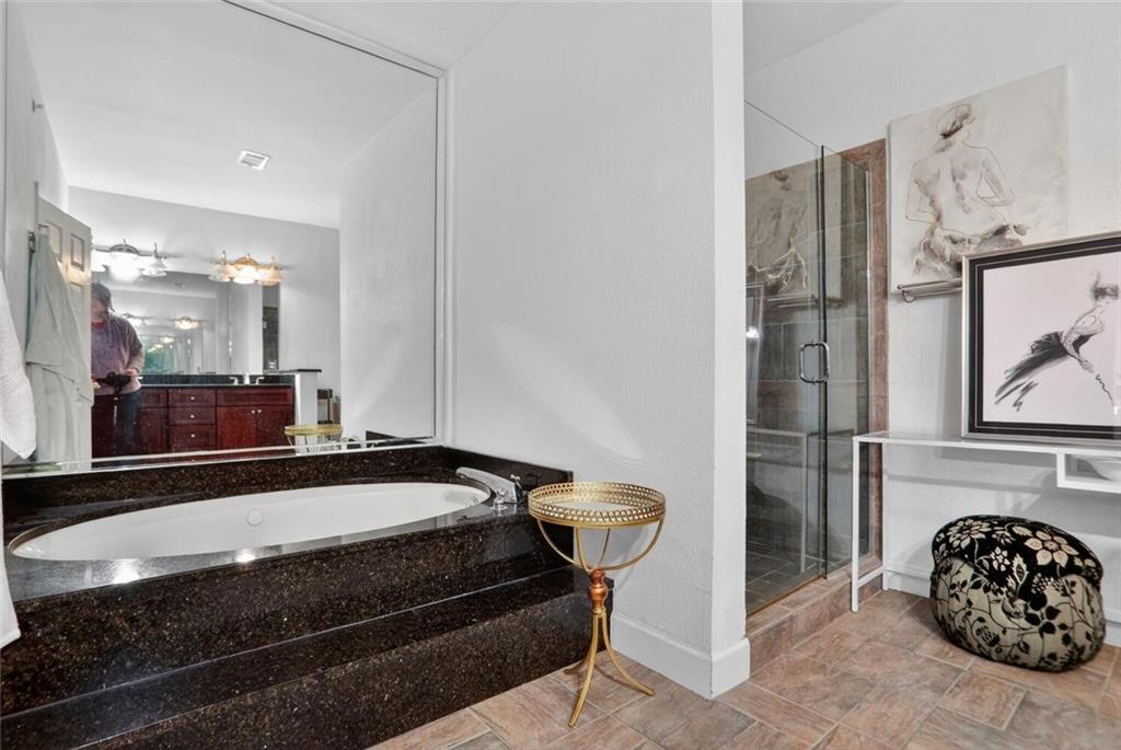 2921 Lenox Road Northeast, Unit 413 Atlanta, GA 30324 - Photo 20 of 36 a bathroom with a sink and a mirror