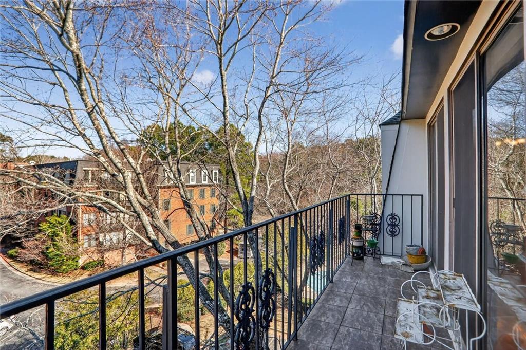 2921 Lenox Road Northeast, Unit 413 Atlanta, GA 30324 - Photo 21 of 36 a view of mountain with couches and wooden fence
