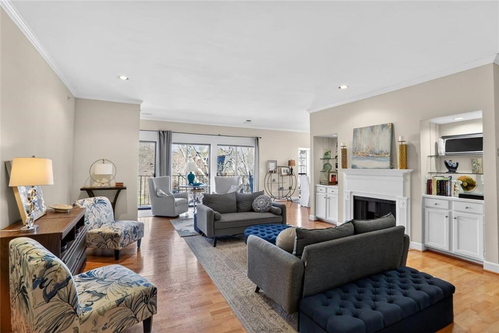2921 Lenox Road Northeast, Unit 413 Atlanta, GA 30324 - Photo 3 of 36 a living room with furniture and a fireplace