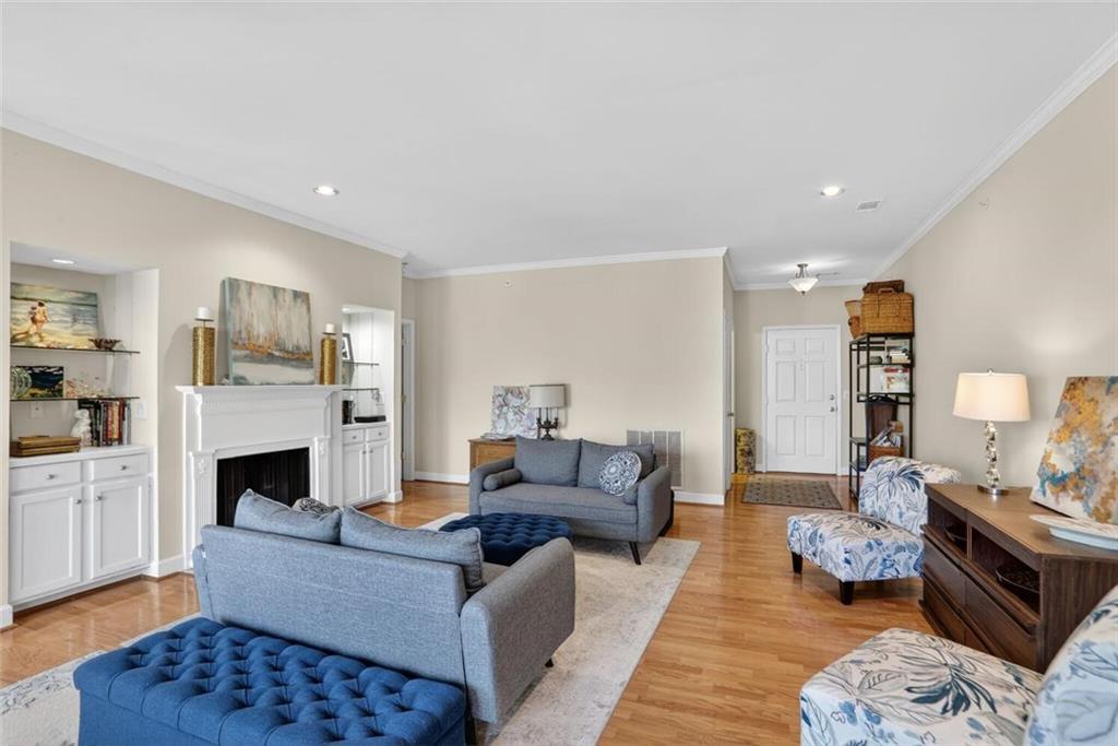 2921 Lenox Road Northeast, Unit 413 Atlanta, GA 30324 - Photo 6 of 36 a living room with furniture and a fireplace