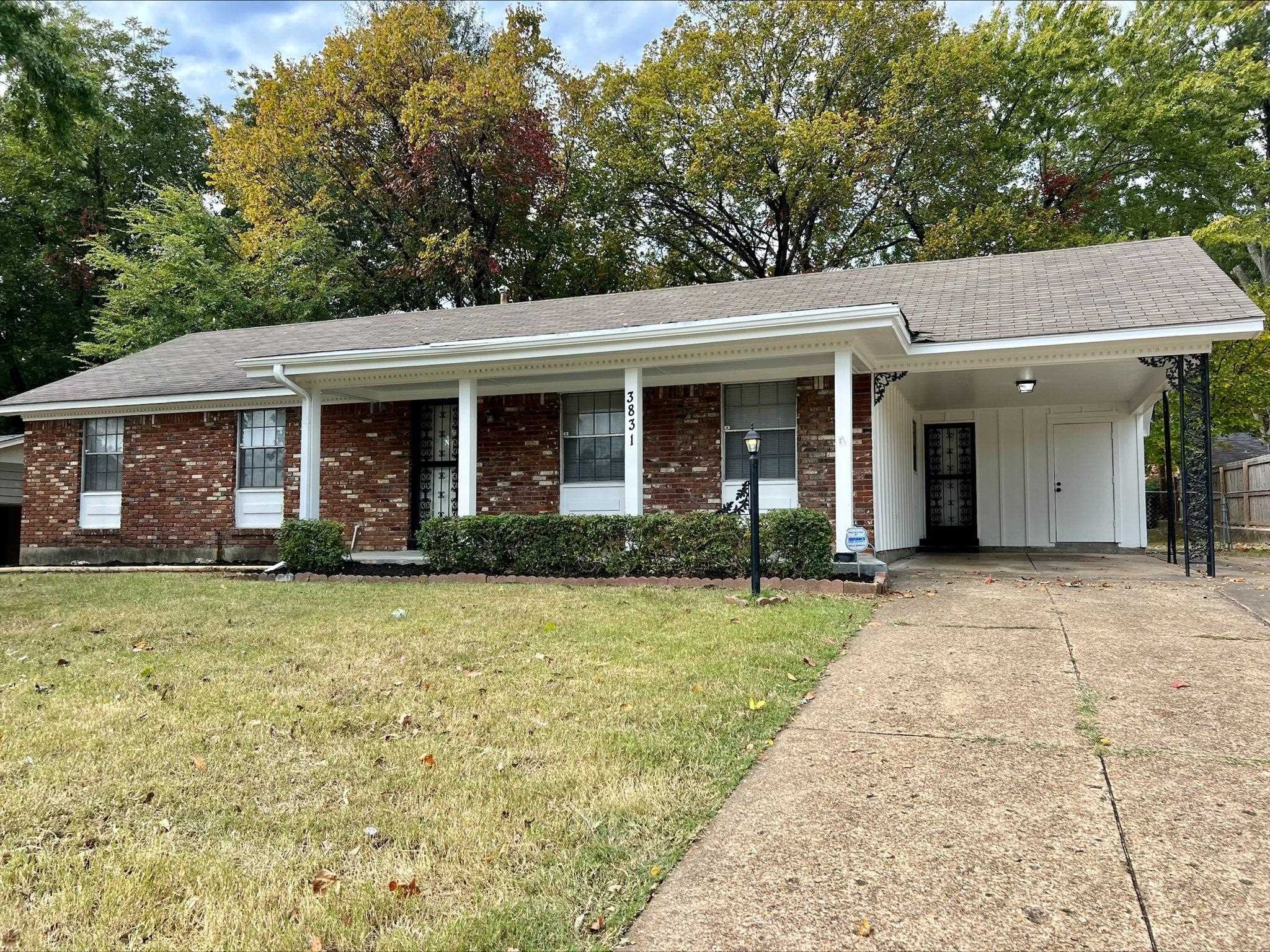 a front view of a house with yard