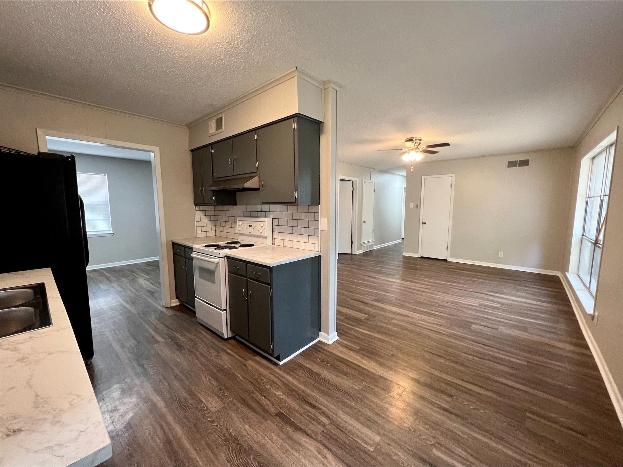 3831 Millbranch Road Memphis, TN 38116 - Photo 3 of 12 a view of kitchen with sink microwave and refrigerator