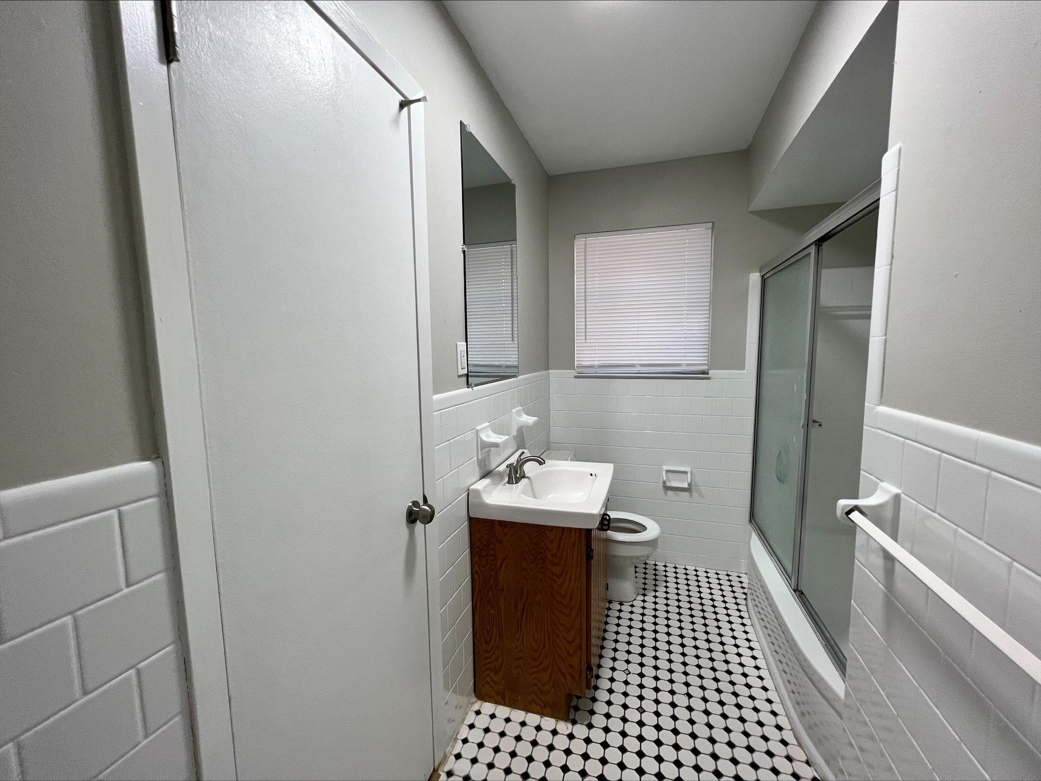 3831 Millbranch Road Memphis, TN 38116 - Photo 8 of 12 a bathroom with a sink and a toilet