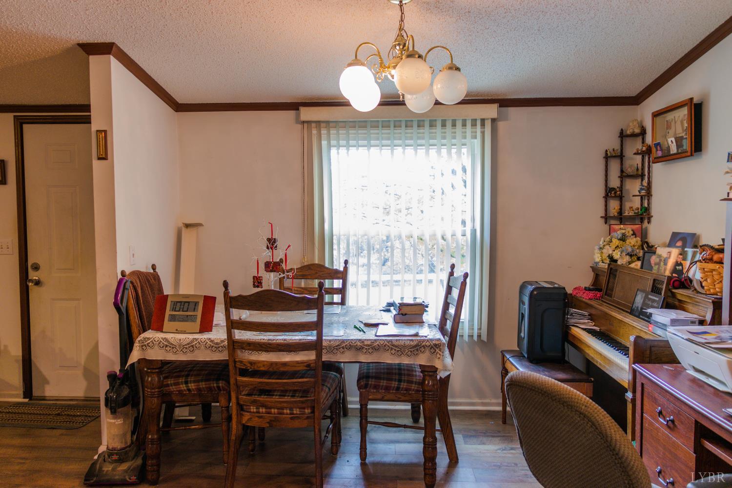 3156 Owens Mill Road Gretna, VA 24557 - Photo 28 of 88 a view of a dining room with furniture window and wooden floor