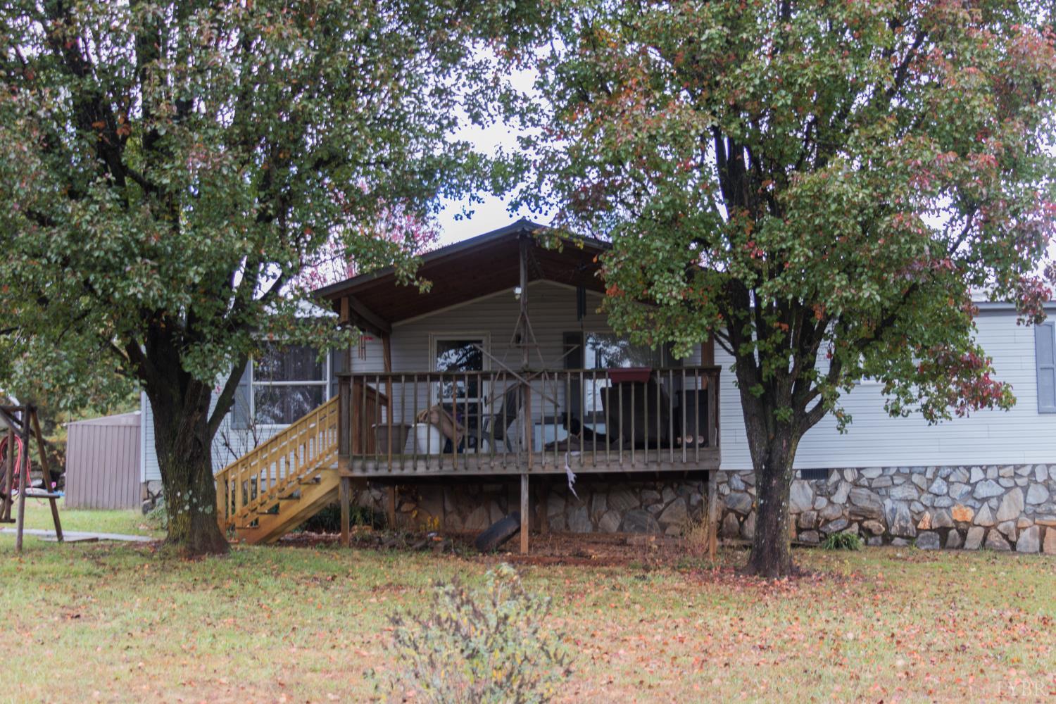 3156 Owens Mill Road Gretna, VA 24557 - Photo 74 of 88 a house with trees in front of it