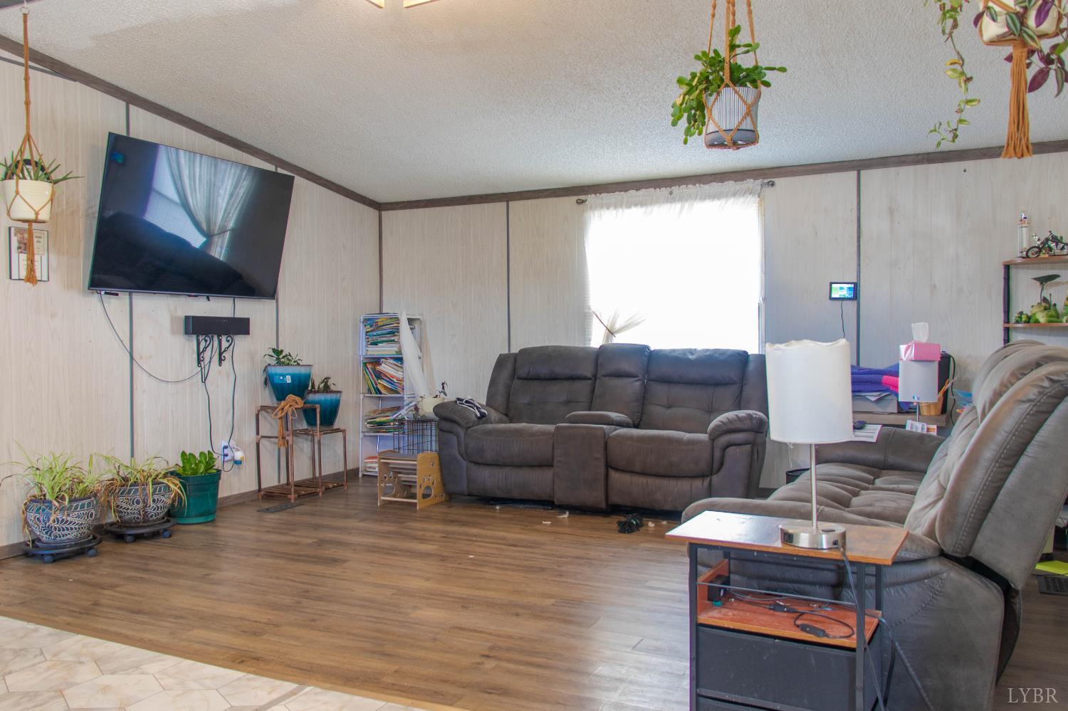 3156 Owens Mill Road Gretna, VA 24557 - Photo 79 of 88 a living room with furniture and a flat screen tv