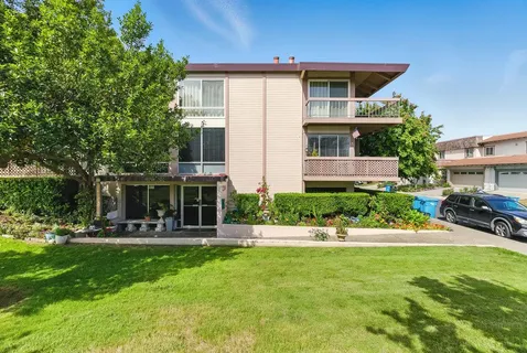 a front view of house with yard and outdoor seating