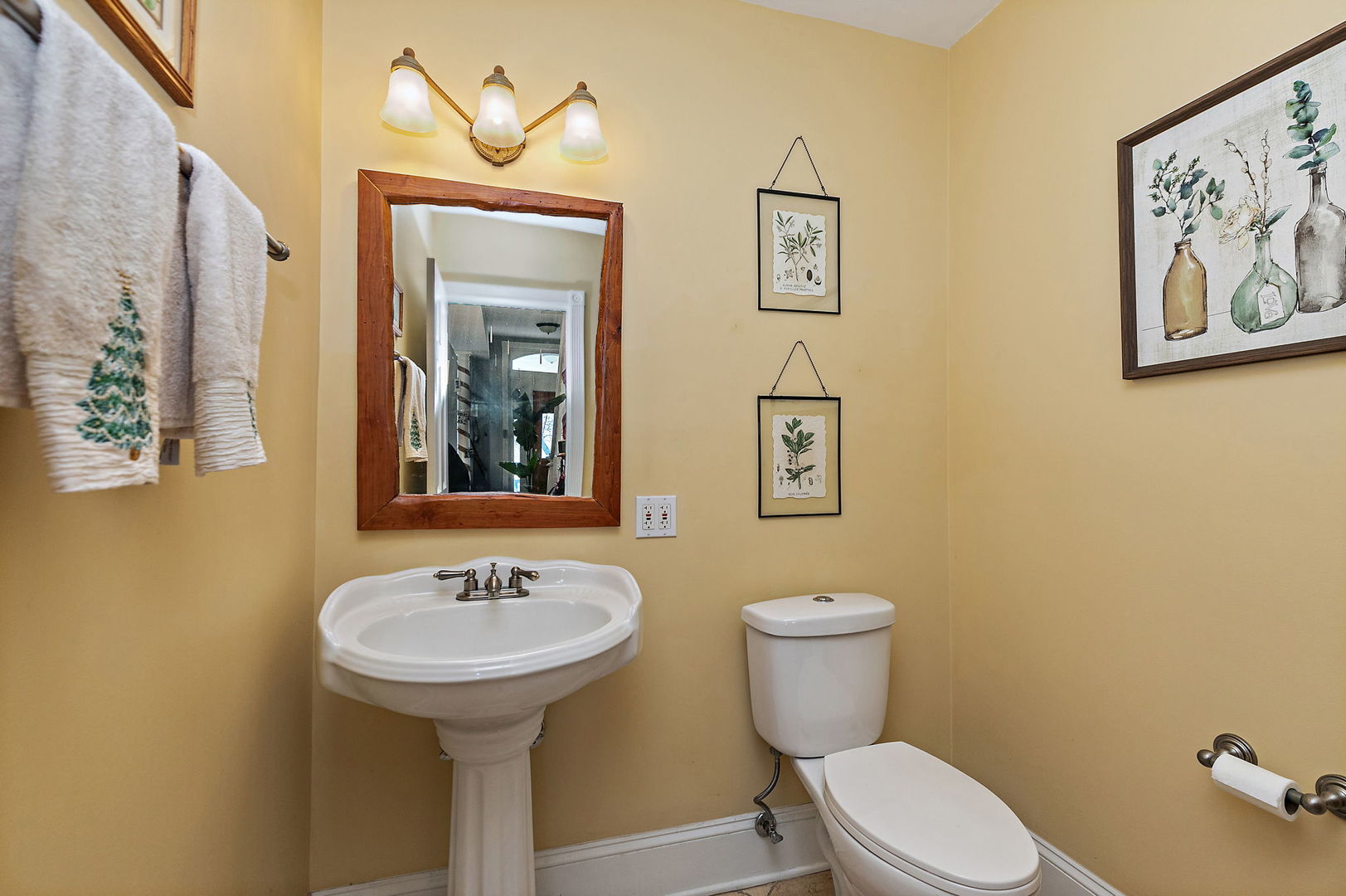 271 Dupage Street Elgin, IL 60120 - Photo 11 of 27 a bathroom with a toilet a sink and mirror