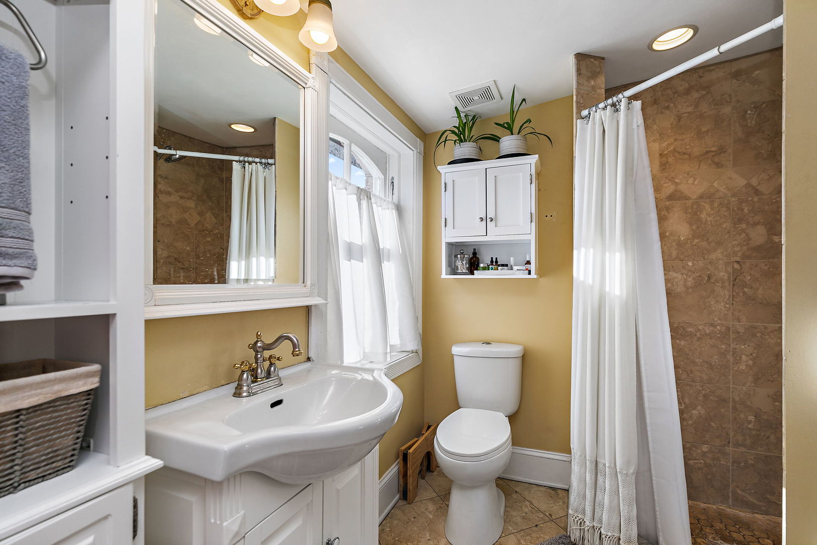 271 Dupage Street Elgin, IL 60120 - Photo 17 of 27 a bathroom with a sink toilet and shower