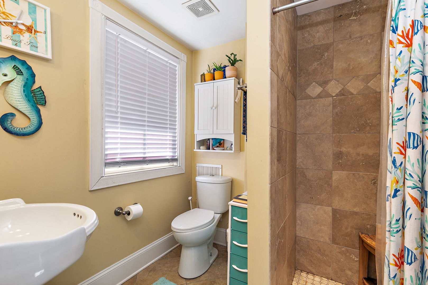 271 Dupage Street Elgin, IL 60120 - Photo 23 of 27 a bathroom with a toilet sink and shower