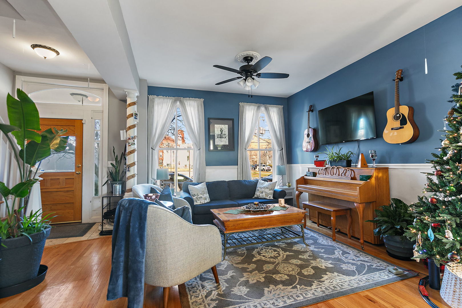 271 Dupage Street Elgin, IL 60120 - Photo 3 of 27 a living room with furniture fireplace and wooden floor