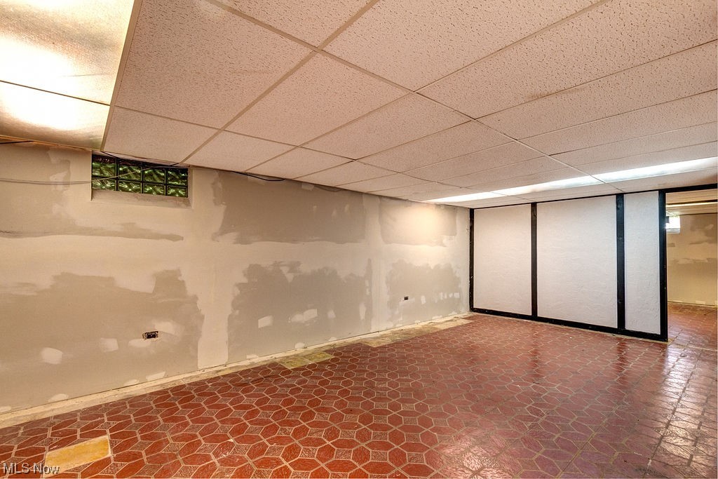 4897 South Sedgewick Road Cleveland, OH 44124 - Photo 19 of 31 Rec room to finish as you need - currently with dark tile floors and a drop ceiling