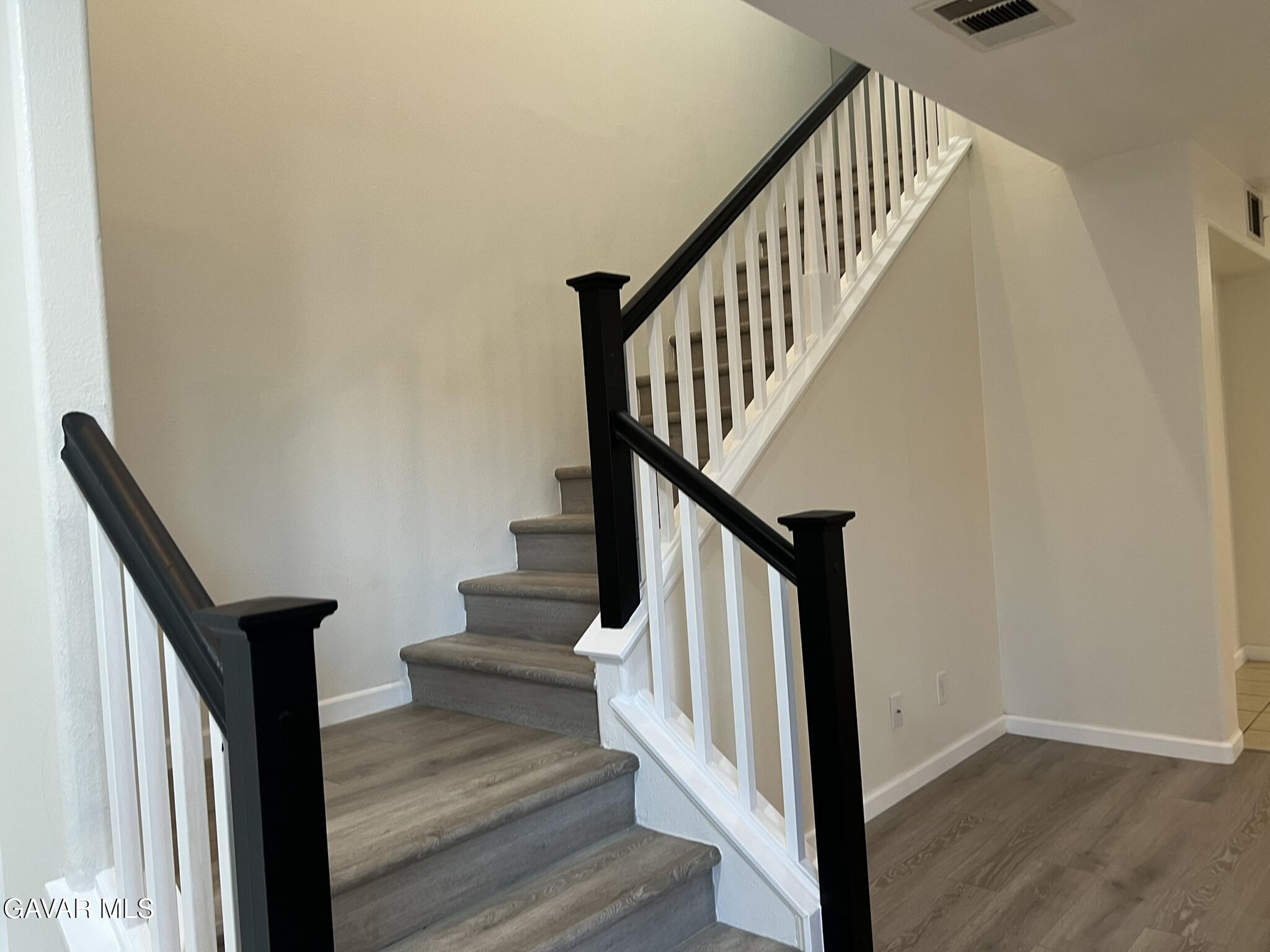 2649 Torres Court Palmdale, CA 93550 - Photo 13 of 33 a view of entryway and hall with wooden floor