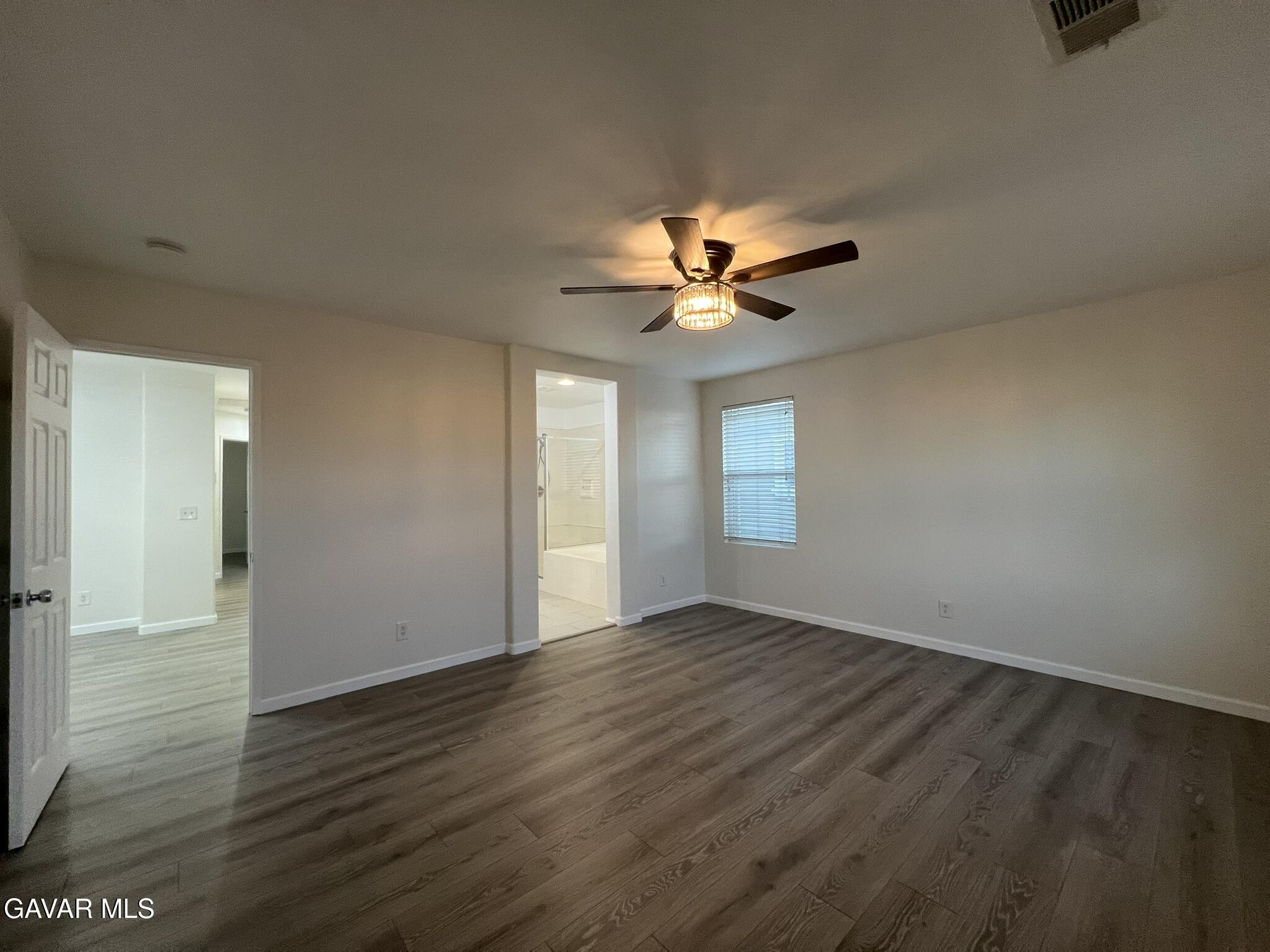 2649 Torres Court Palmdale, CA 93550 - Photo 18 of 33 a view of an empty room with wooden floor