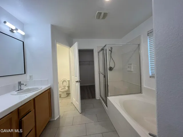 a bathroom with a bathtub and a sink