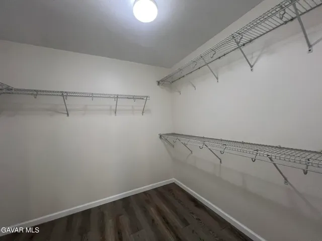 a view of a room with racks on the wall