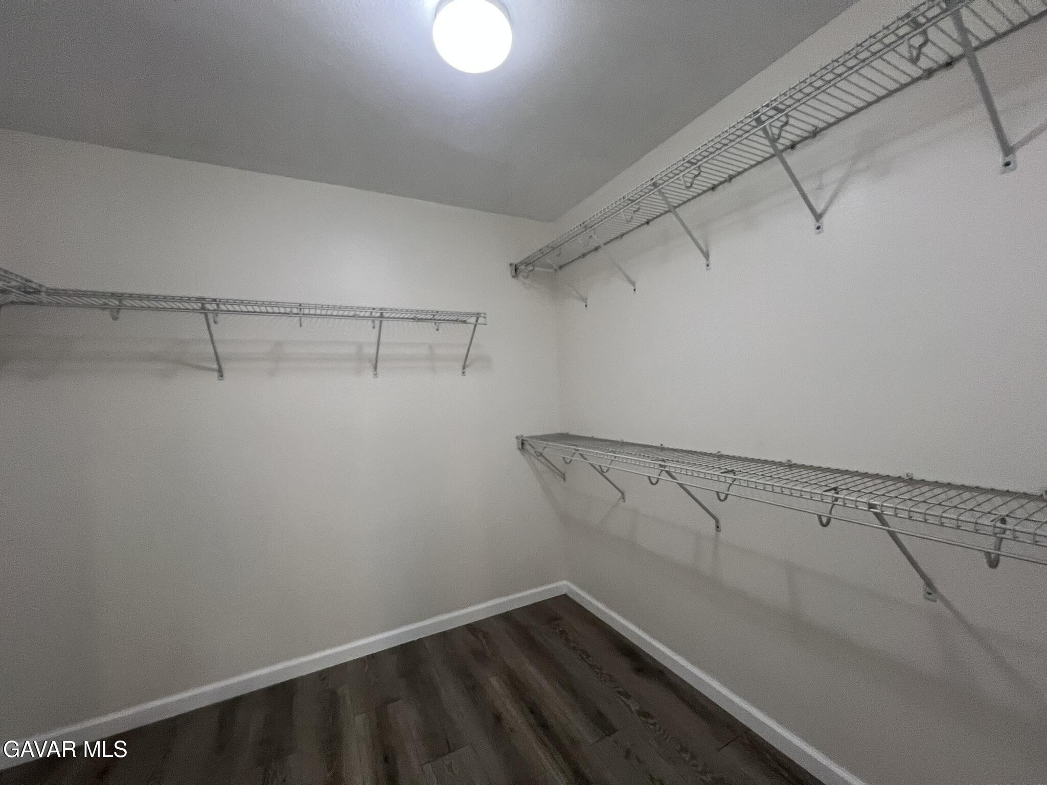 2649 Torres Court Palmdale, CA 93550 - Photo 23 of 33 a view of a room with racks on the wall