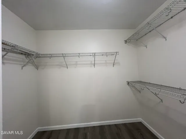 a view of a room with racks on the wall