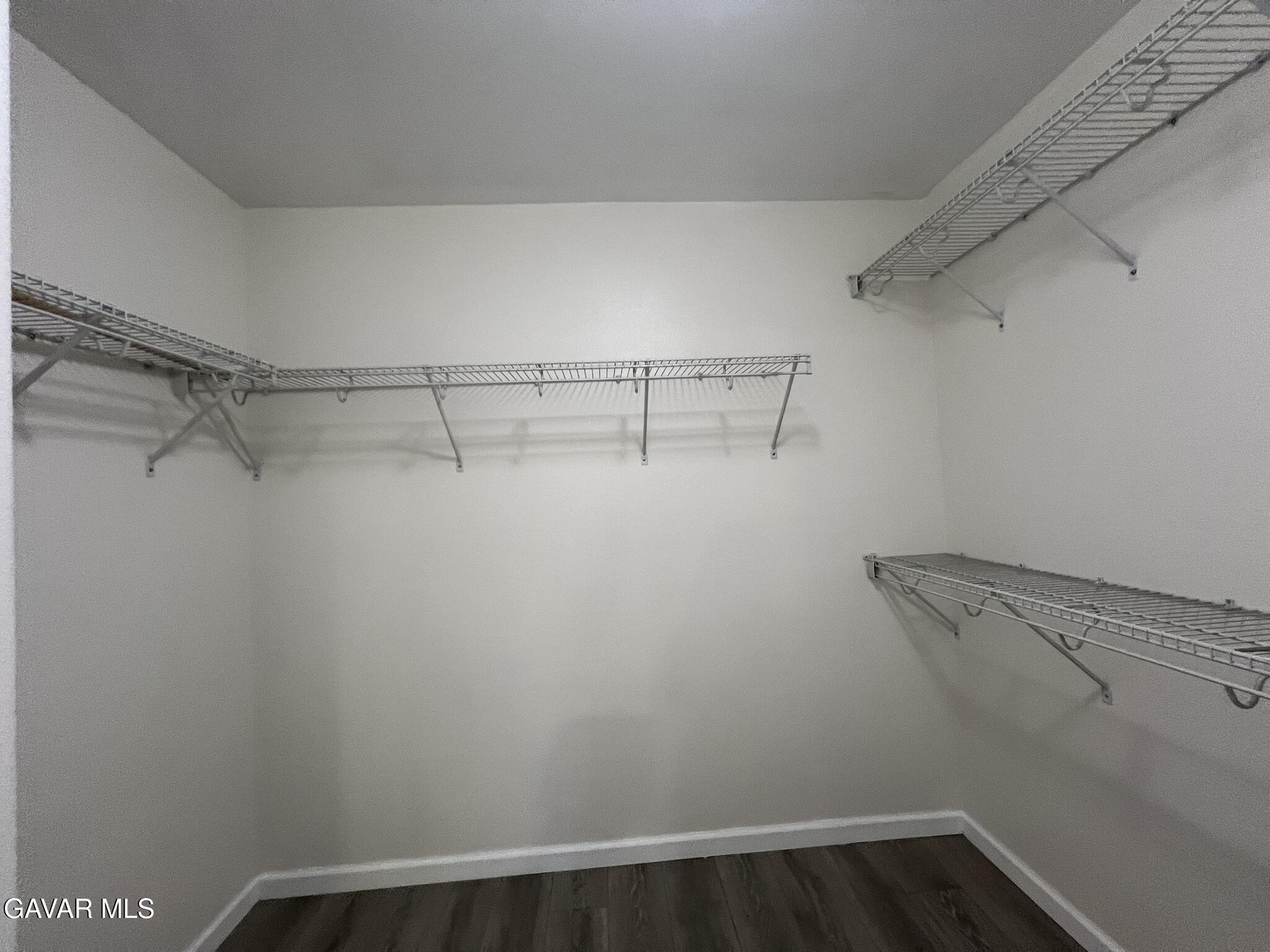 2649 Torres Court Palmdale, CA 93550 - Photo 24 of 33 a view of a room with racks on the wall