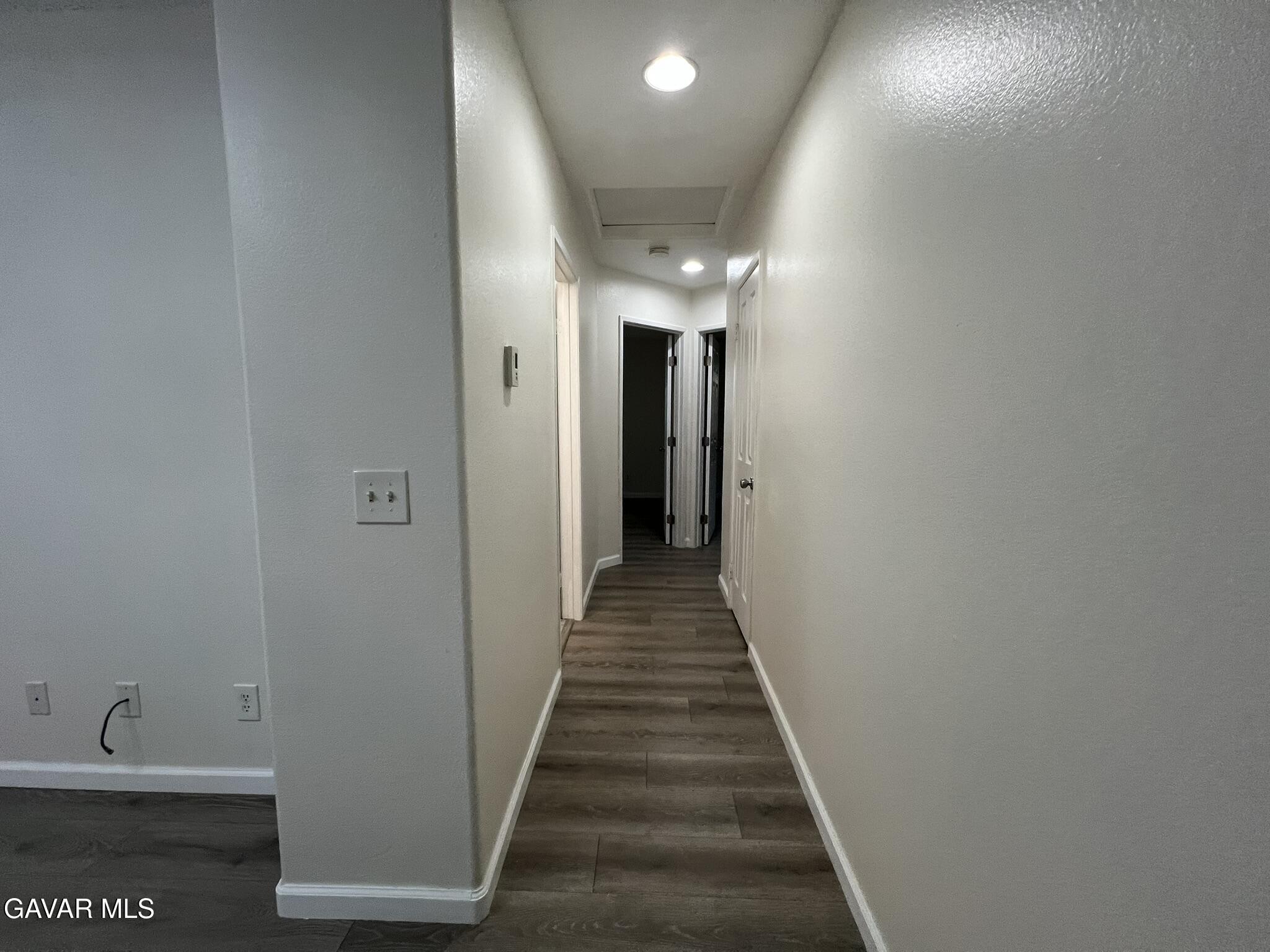 2649 Torres Court Palmdale, CA 93550 - Photo 26 of 33 a view of a hallway with wooden floor and staircase