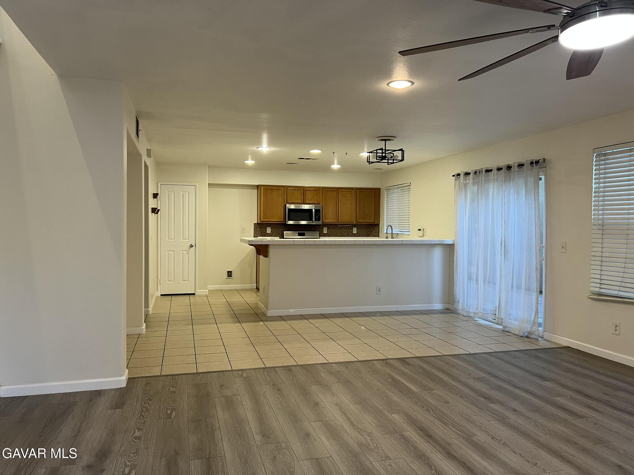 2649 Torres Court Palmdale, CA 93550 - Photo 8 of 33 a view of a kitchen with a sink and cabinets