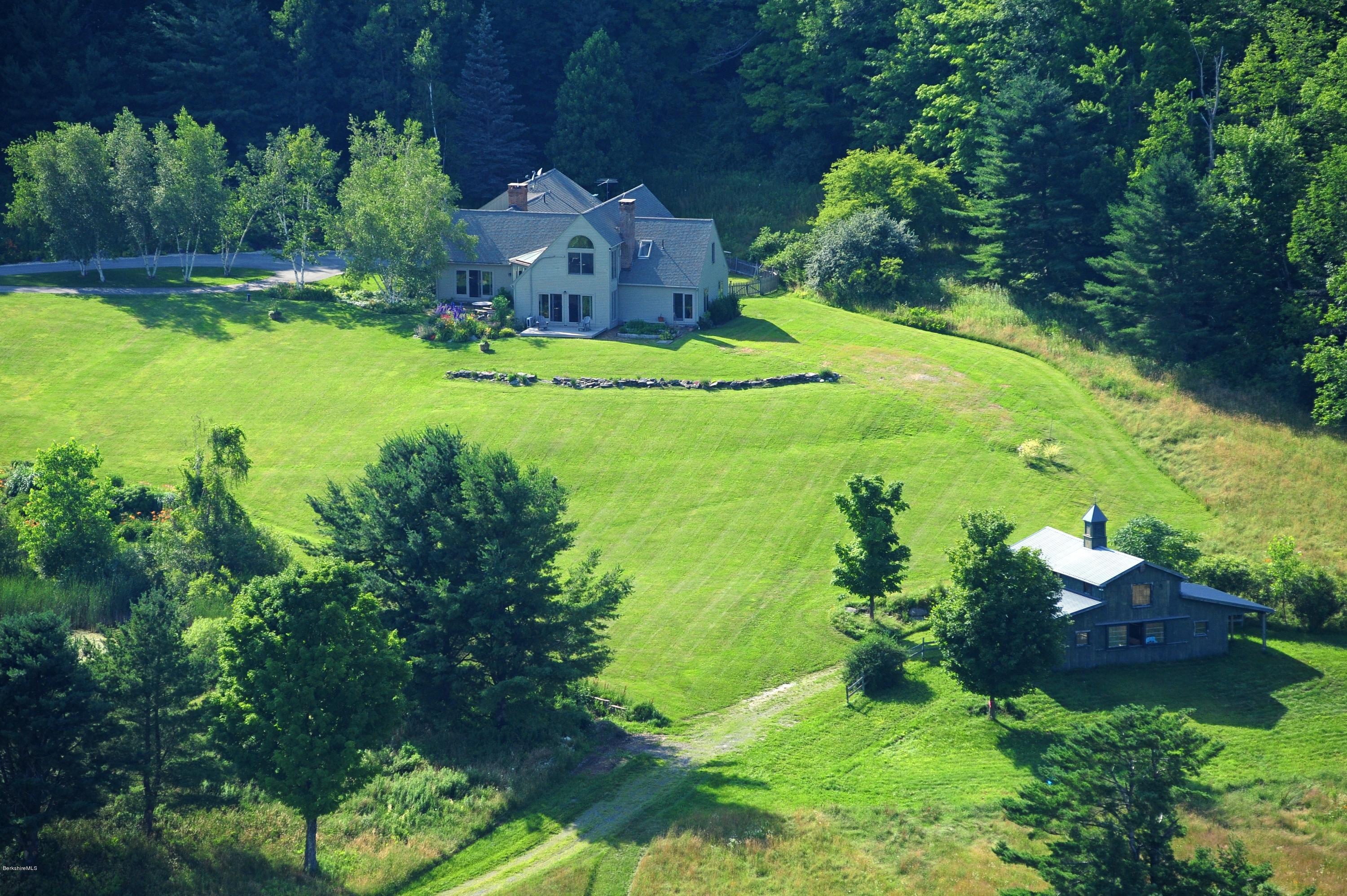 178 Perry Peak Road Richmond, MA 01254 - Photo 1 of 13 an aerial view of a house with a yard