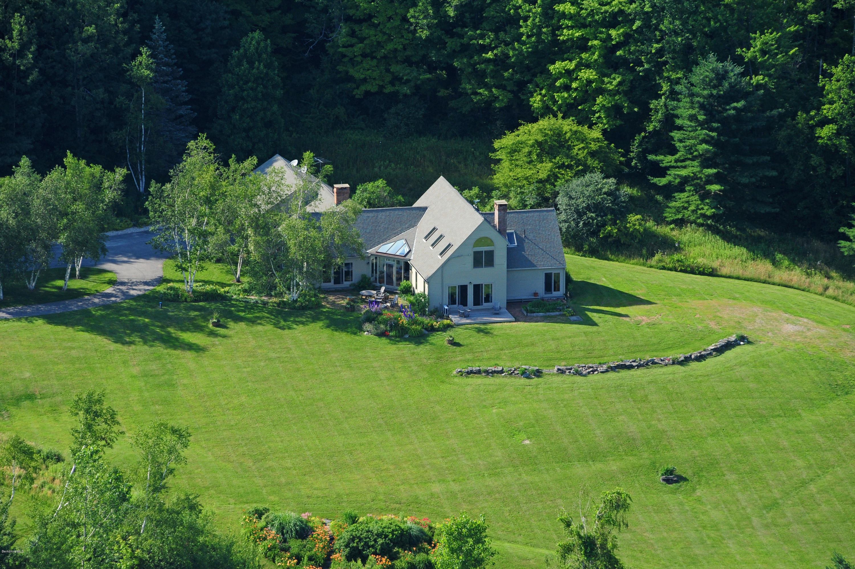 178 Perry Peak Road Richmond, MA 01254 - Photo 2 of 13 a front view of a house with a yard