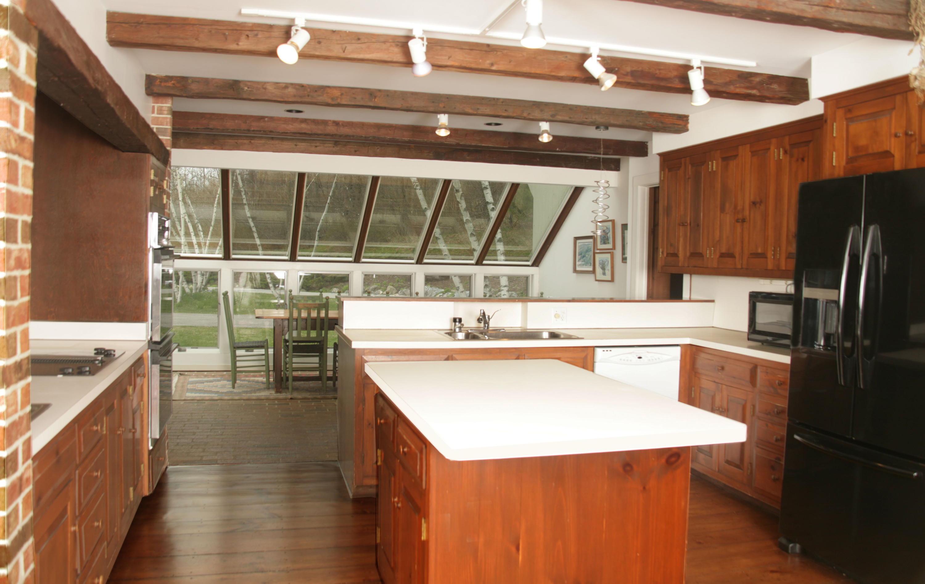 178 Perry Peak Road Richmond, MA 01254 - Photo 12 of 13 a kitchen with a refrigerator a stove and a sink with wooden floor