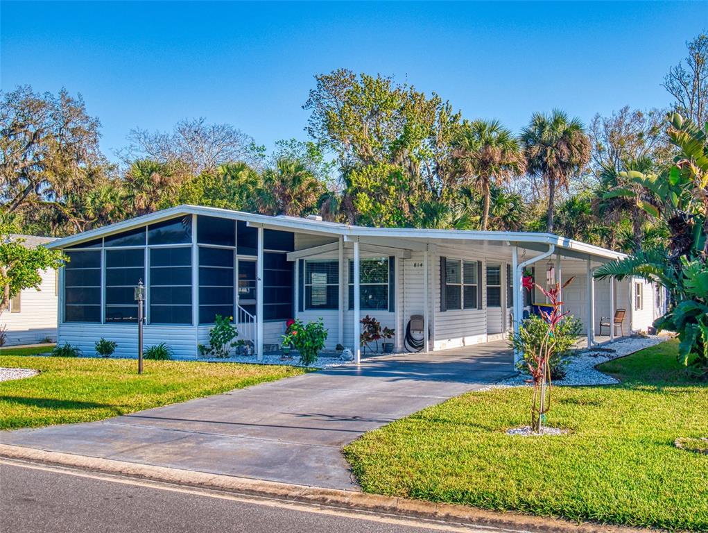 814 Navigators Way Edgewater, FL 32141 - Photo 1 of 1 a front view of a house with a yard and porch