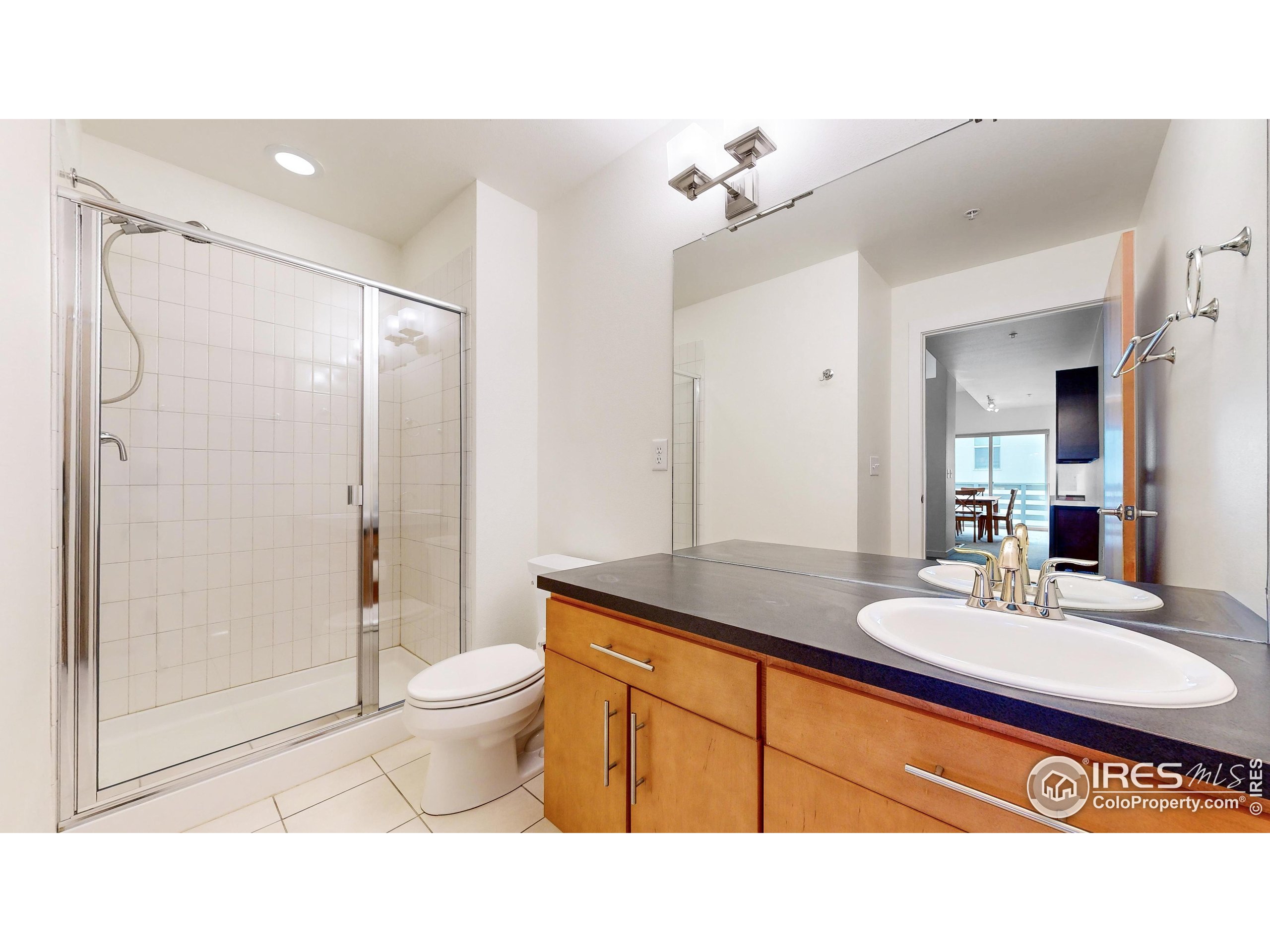 204 Maple Street, Unit 403 Fort Collins, CO 80521 - Photo 16 of 31 a bathroom with a sink toilet and shower