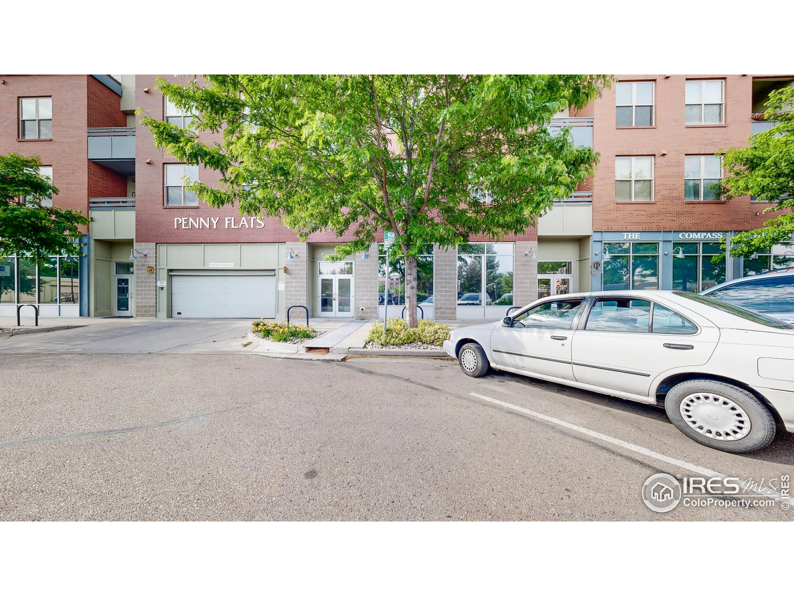 204 Maple Street, Unit 403 Fort Collins, CO 80521 - Photo 29 of 31 a couple of cars parked in front of a building