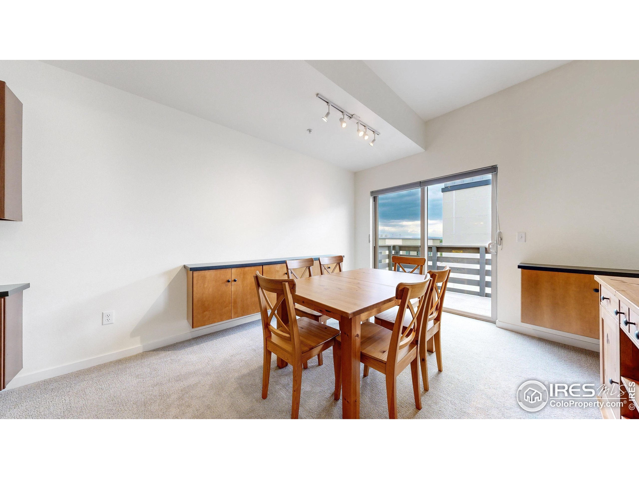 204 Maple Street, Unit 403 Fort Collins, CO 80521 - Photo 6 of 31 a dining room with furniture and a window