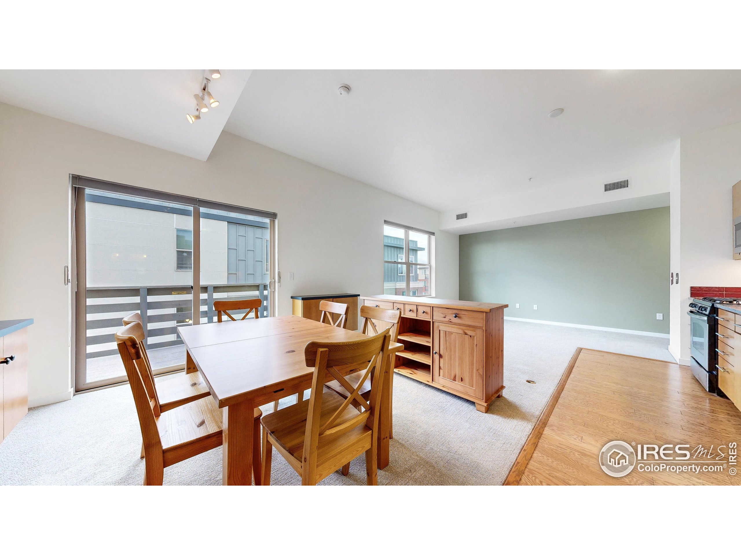 204 Maple Street, Unit 403 Fort Collins, CO 80521 - Photo 7 of 31 a living room with furniture and a table
