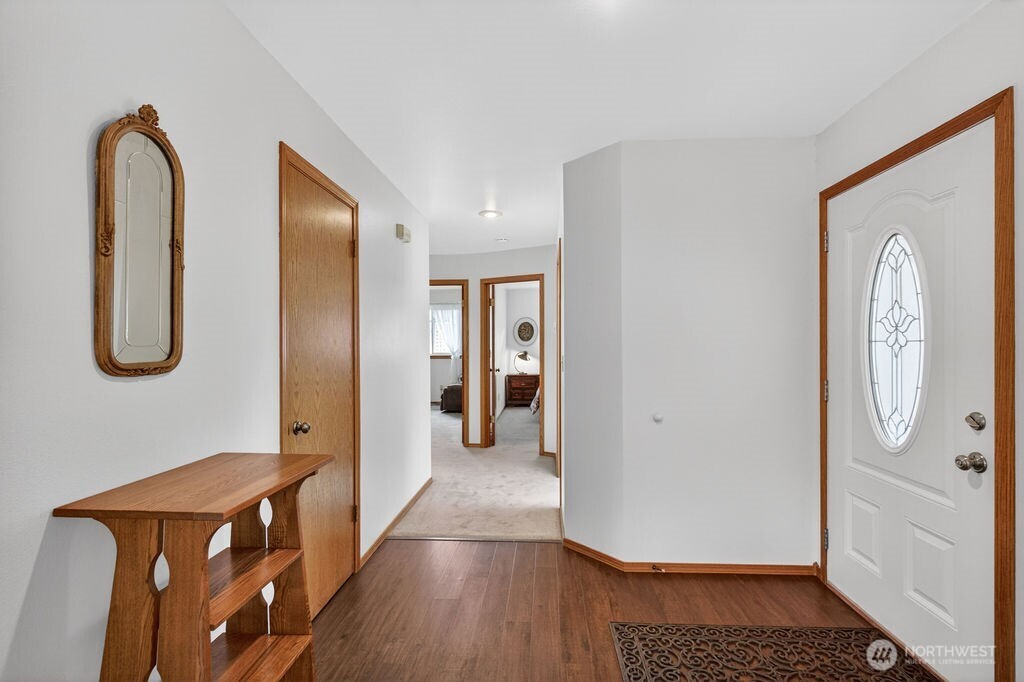 2105 Sutton Place Wenatchee, WA 98801 - Photo 11 of 39 a view of a hallway with elevator with wooden floor