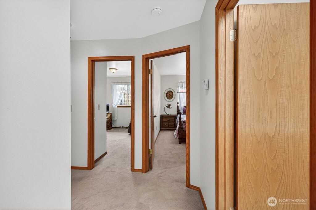 2105 Sutton Place Wenatchee, WA 98801 - Photo 12 of 39 a view of a hallway with wooden shelves