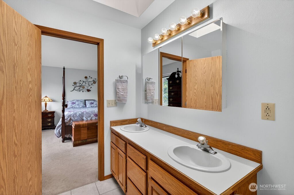 2105 Sutton Place Wenatchee, WA 98801 - Photo 22 of 39 a bathroom with a sink and a mirror