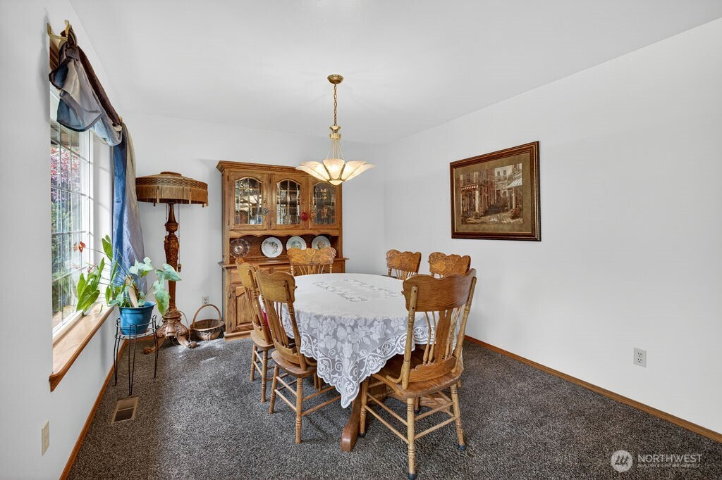 2105 Sutton Place Wenatchee, WA 98801 - Photo 26 of 39 a view of a dining room with furniture window and outside view