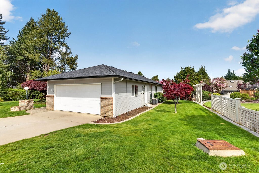 2105 Sutton Place Wenatchee, WA 98801 - Photo 3 of 39 a front view of a house with garden